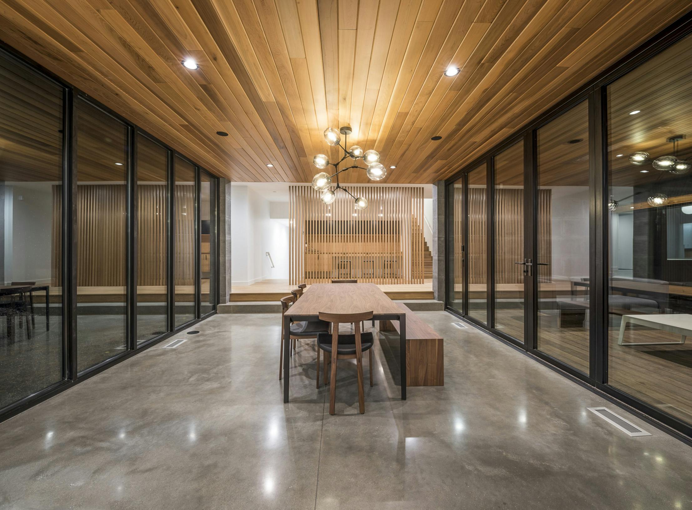Inviting Lakeside 3-Season Porch with Folding Glass Door System